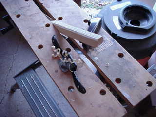 shaping the wood with a spokeshave